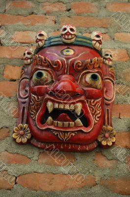 Mahakala mask with crown with five skulls