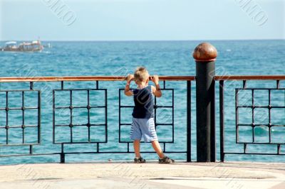 happy young boy looking horizon