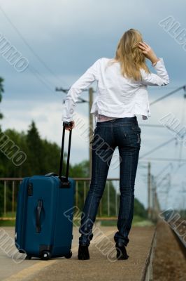young lady waiting a train