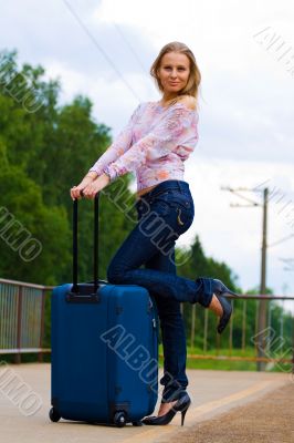 young lady waiting a train