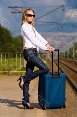 young lady waiting a train