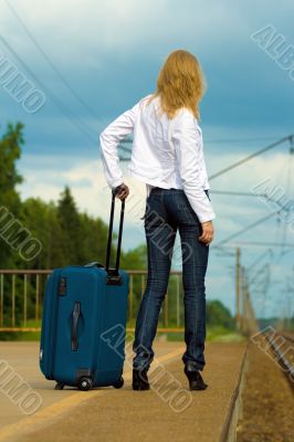 young lady waiting a train