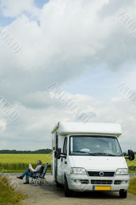 Man relaxing by his campingcar