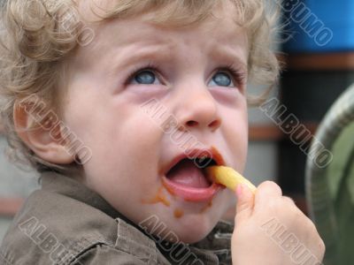 boy eating fries
