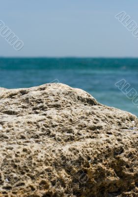 rocky cliff and blue sea