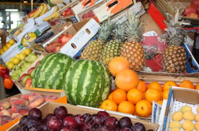 Bright tropical fruit on a market counter Bright tropical fruit on a market counter