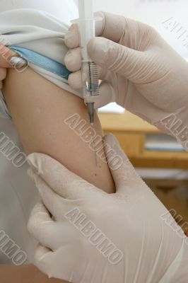 nurse hand with syringe doing injection