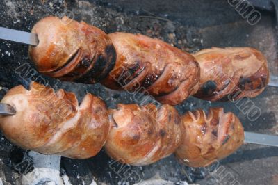 Preparing meat barbecue upon open fire