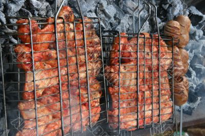 Preparing meat barbecue upon open fire