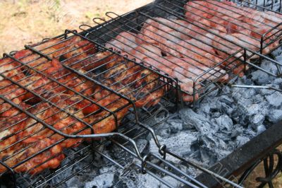 Preparing meat barbecue upon open fire