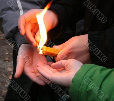 Flaming candle upon palms protection Flaming candle upon palms protection