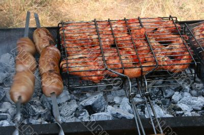 Preparing meat barbecue upon open fire