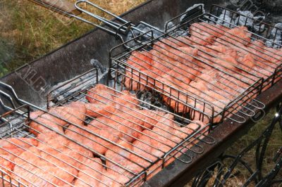 Preparing meat barbecue upon open fire