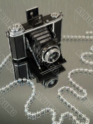 Old camera with jewelry