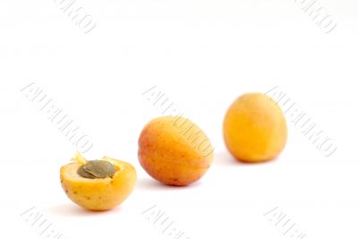 Fresh appetizing apricots on a white background