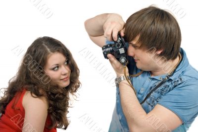 Photographer taking pictures of the young woman