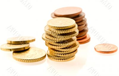 piles of european coins over white