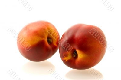 two ripe fresh nectarines