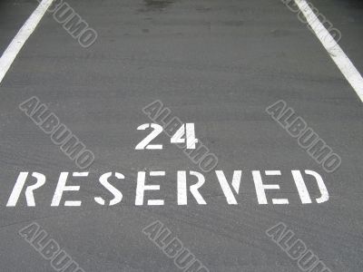 reserved sign on the asphalt