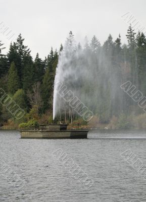 fountain in the middle of a lake