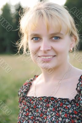 Girl in the meadow looking at camera