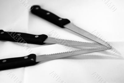 Three Serrated Knives