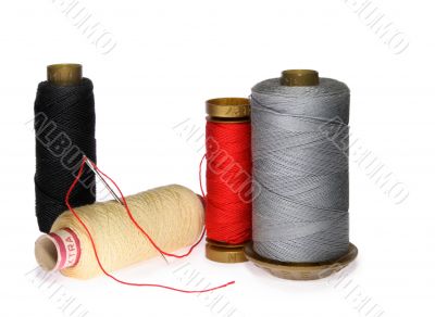 Reels of thread and needle