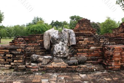 Buddha and brick wall