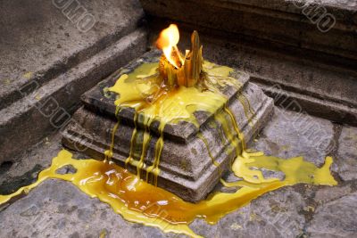Yellow candle in temple