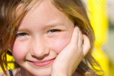 Smiling six year old girl at playground 2