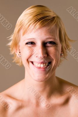 Blond girl with short hair making fun