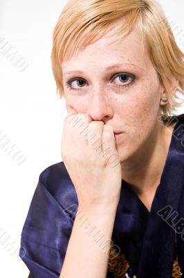 Blond girl with short hair looking sad