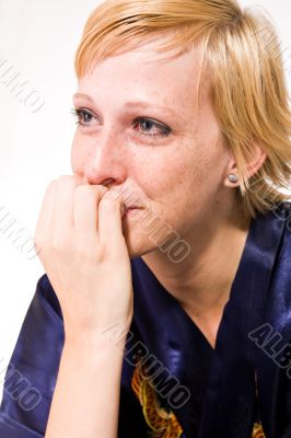 Blond girl with short hair in tears
