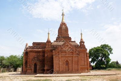 Brick temple with golden spire