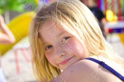 Smiling six year old girl at playground