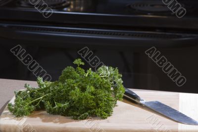 Food on a cutting board with chef`s knife