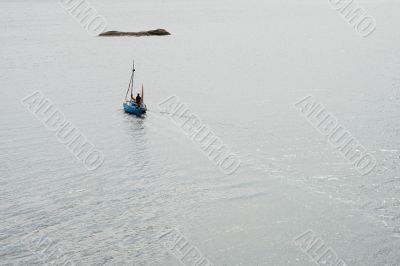 Solo sailor in small boat