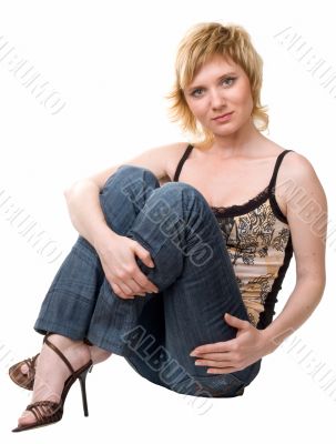 woman sits on a white background