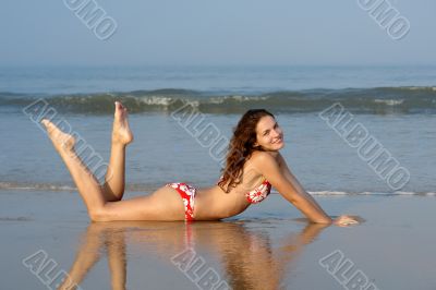 Beautiful girl on the ocean beach