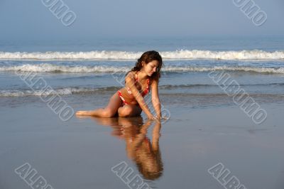 Beautiful girl on the ocean beach