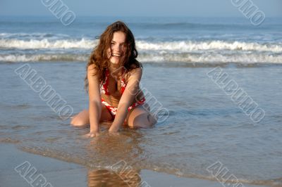 Beautiful girl on the ocean beach