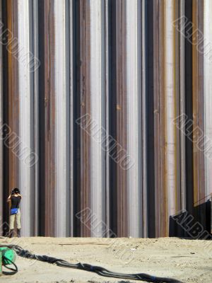 girl taking pictures of metal girders