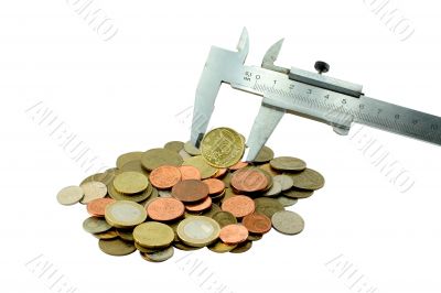 Coins and measuring tool