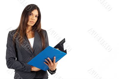 Beautiful brunette businesswoman holding clipboard