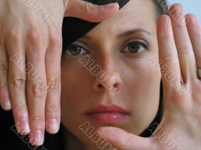 girl portrait with hands around her face