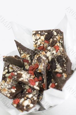 chocolate slices with berries and nuts