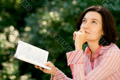female reading in park