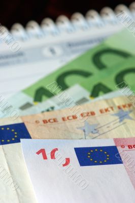 Money with euro signs and calendar