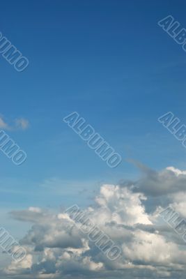 fluffy cloud on bright blue sky