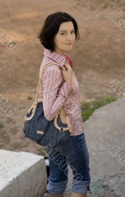 pretty brunet woman with bag